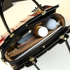 Interior view of the Elegant Sequin Patent Handbag showcasing organized compartments with personal items.