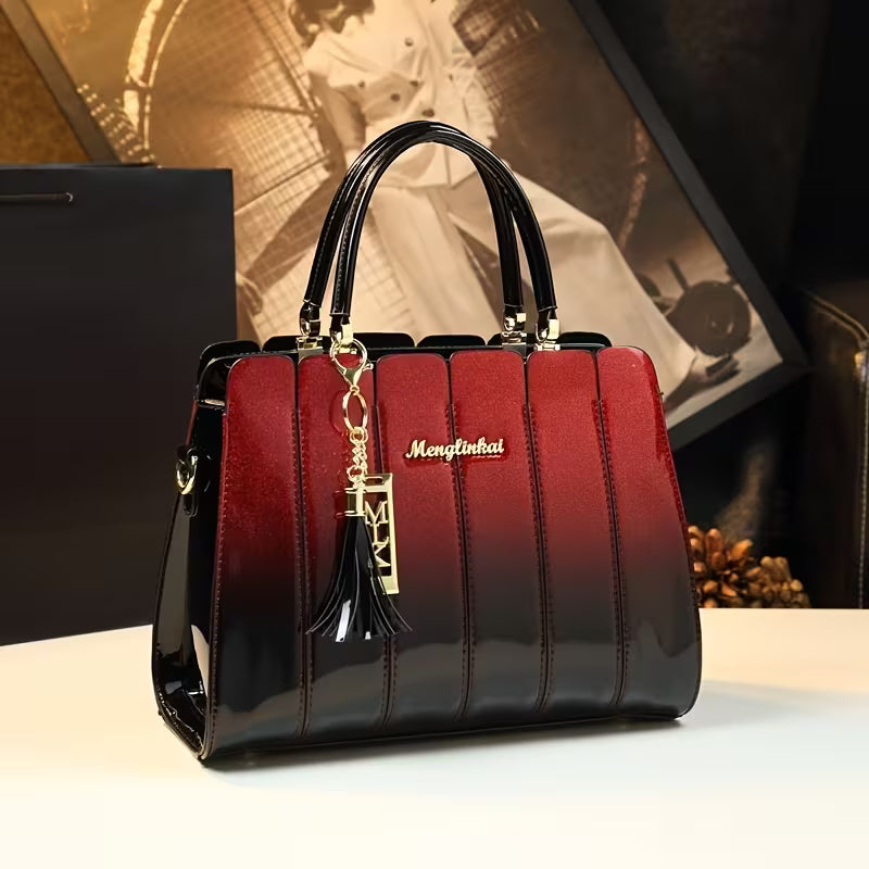 Elegant Sequin Patent Handbag featuring a stylish red and black design with glossy finish and decorative keychain.